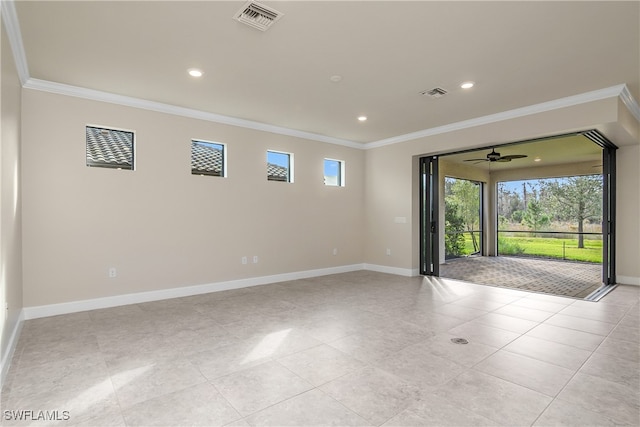 tiled empty room with ornamental molding and ceiling fan