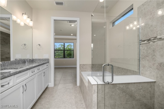 bathroom featuring shower with separate bathtub, ornamental molding, vanity, and tile patterned floors