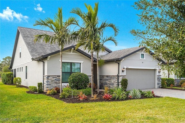 view of front of home featuring a garage and a front lawn