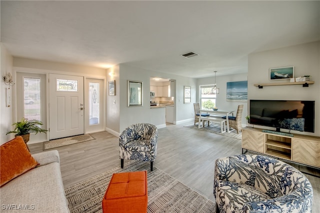 living room with light hardwood / wood-style floors