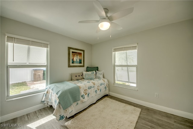 bedroom featuring ceiling fan and hardwood / wood-style flooring