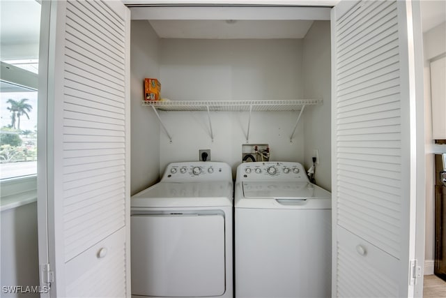 clothes washing area featuring washing machine and dryer