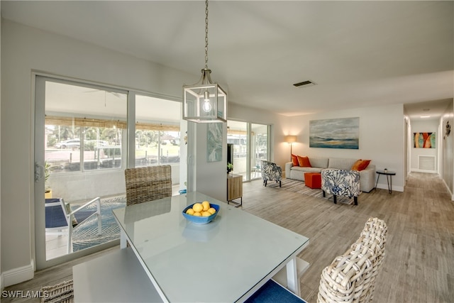 dining space featuring light hardwood / wood-style floors