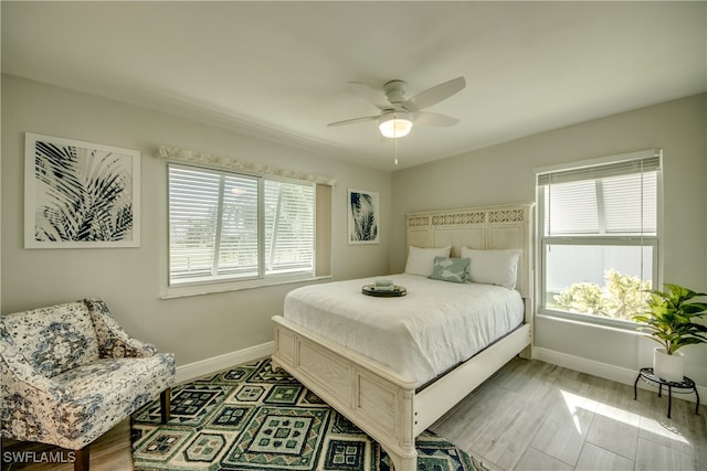 bedroom featuring ceiling fan and light hardwood / wood-style flooring