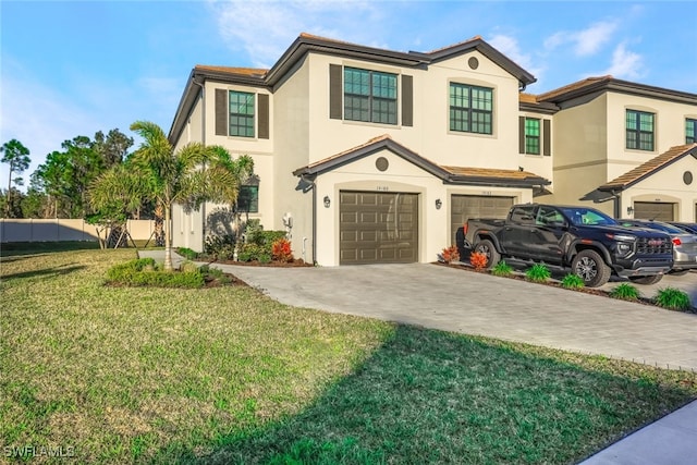 view of front of property with a garage and a front yard