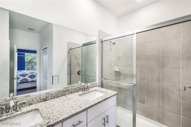 bathroom with vanity and walk in shower