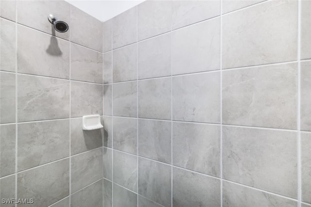 bathroom with a tile shower