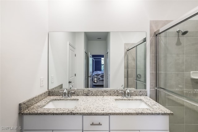 bathroom with vanity and walk in shower