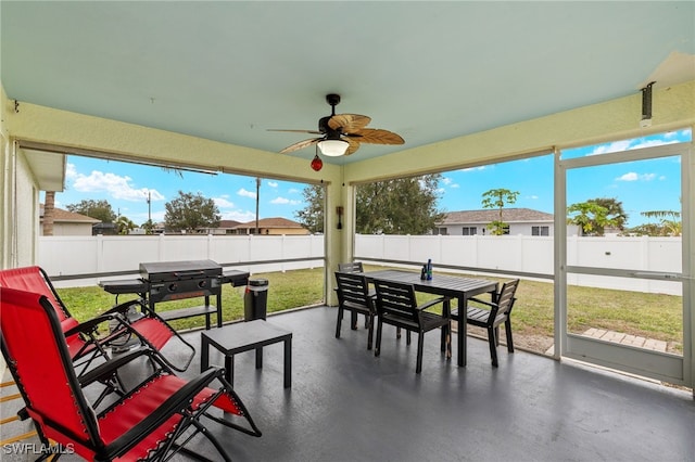 sunroom / solarium with ceiling fan