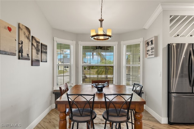 dining room featuring a chandelier and light hardwood / wood-style floors