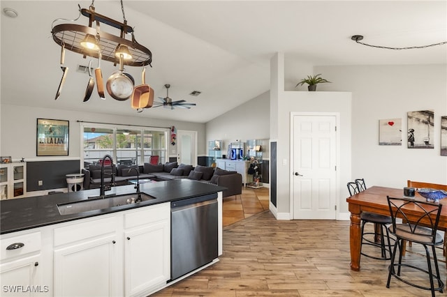 kitchen with stainless steel dishwasher, light hardwood / wood-style floors, white cabinetry, ceiling fan, and sink