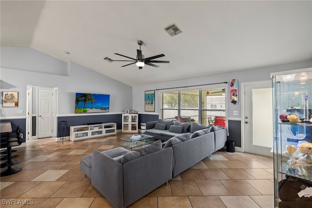 tiled living room featuring lofted ceiling and ceiling fan