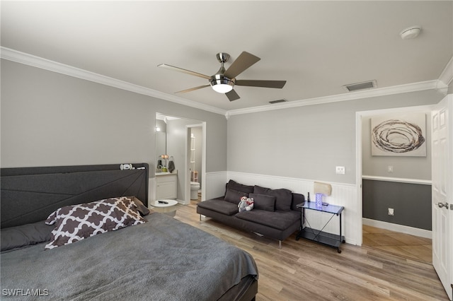 bedroom with ceiling fan, ornamental molding, and hardwood / wood-style floors