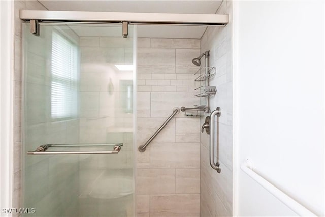 bathroom with an enclosed shower