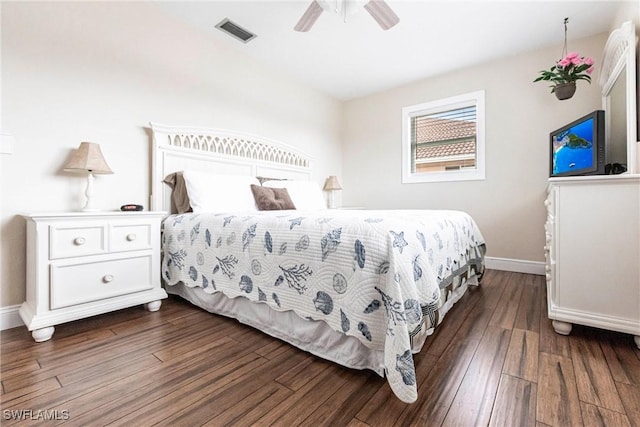 bedroom with ceiling fan and dark hardwood / wood-style floors