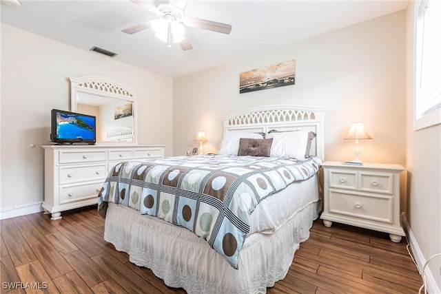 bedroom featuring ceiling fan and dark wood-type flooring