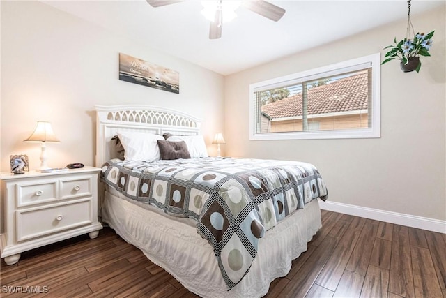 bedroom with dark hardwood / wood-style floors and ceiling fan