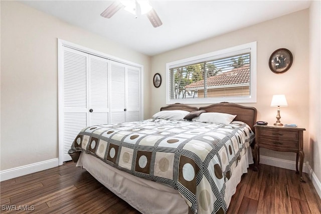 bedroom featuring ceiling fan, dark hardwood / wood-style floors, and a closet