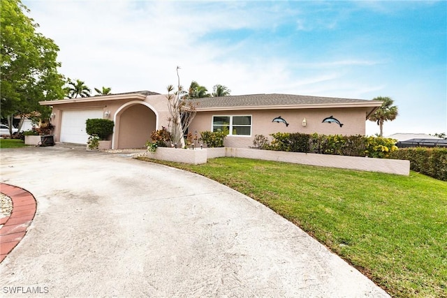 single story home featuring a garage and a front lawn