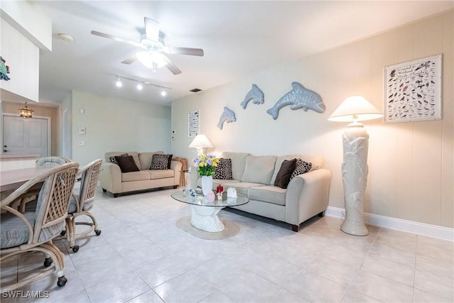 tiled living room with ceiling fan