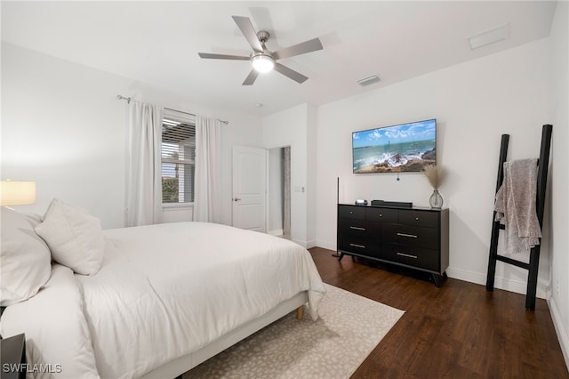 bedroom featuring ceiling fan and dark wood-type flooring