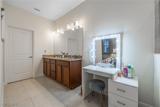 bathroom featuring vanity and tile patterned flooring