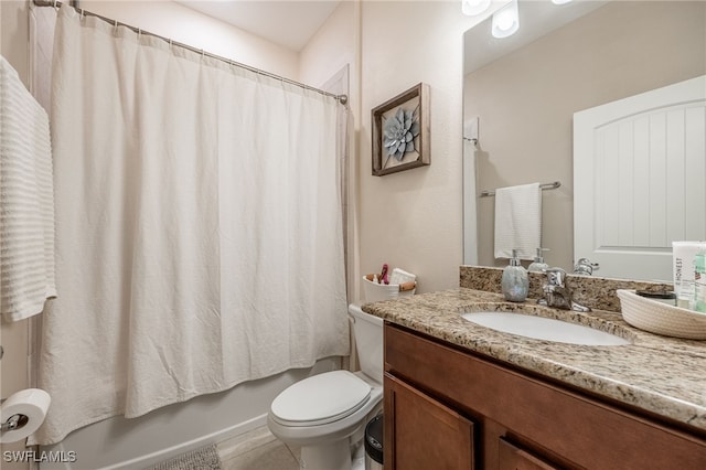 full bathroom featuring shower / bath combo with shower curtain, toilet, and vanity