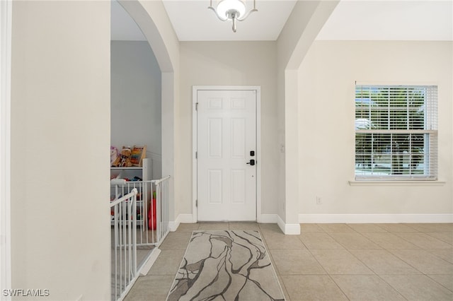 entryway with light tile patterned floors