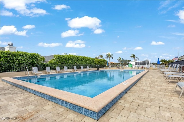 view of swimming pool with a patio area