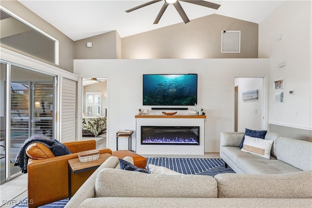 living room with ceiling fan and lofted ceiling