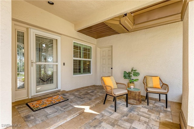 doorway to property with a patio area