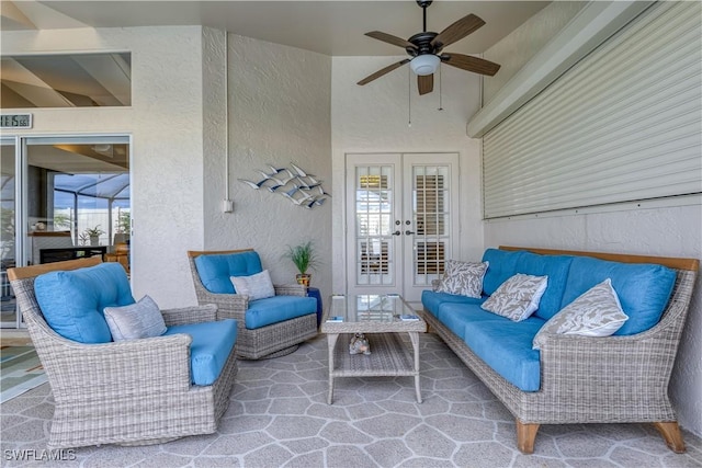 view of patio featuring ceiling fan and french doors