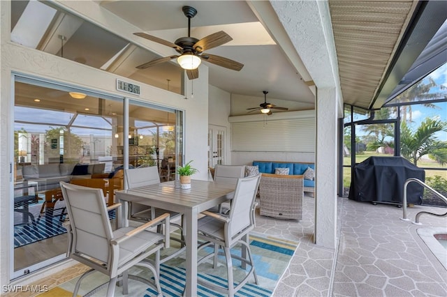 view of patio / terrace featuring a lanai, an outdoor hangout area, ceiling fan, and area for grilling