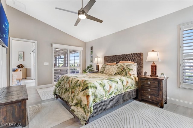 bedroom with light wood-type flooring, ceiling fan, and vaulted ceiling