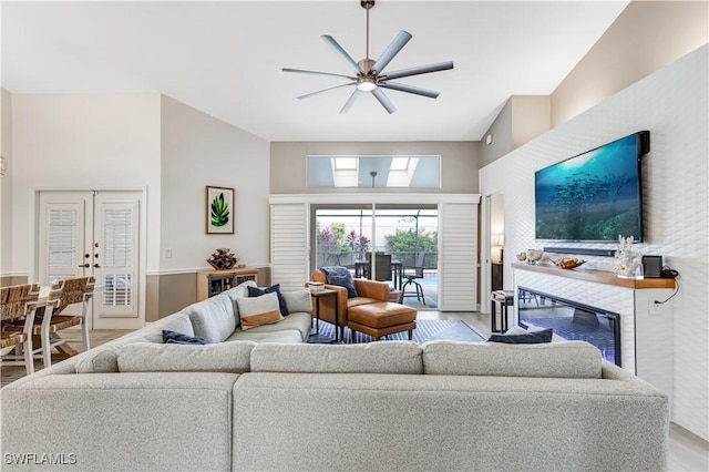 living room with ceiling fan and french doors