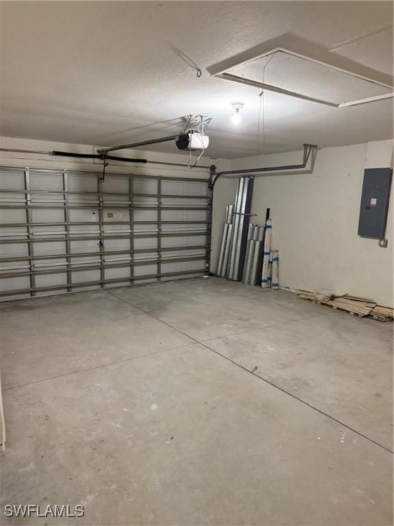 garage with electric panel and a garage door opener