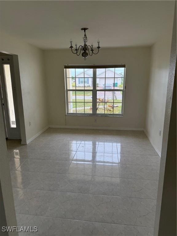 unfurnished dining area featuring an inviting chandelier