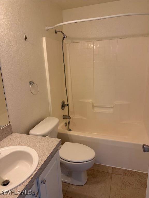 full bathroom with toilet, shower / bathing tub combination, tile patterned flooring, and vanity