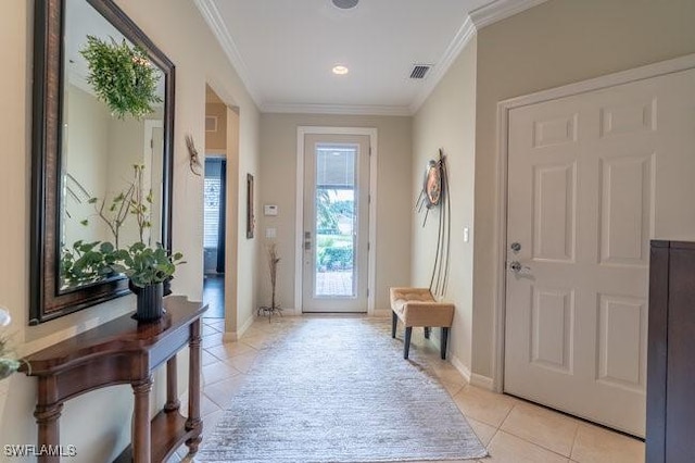 doorway to outside with light tile patterned floors and crown molding