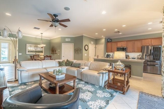 living room featuring ceiling fan, light tile patterned flooring, and ornamental molding