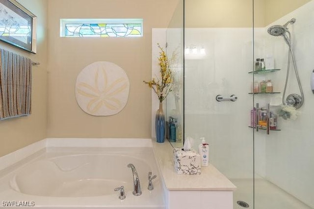 bathroom featuring separate shower and tub