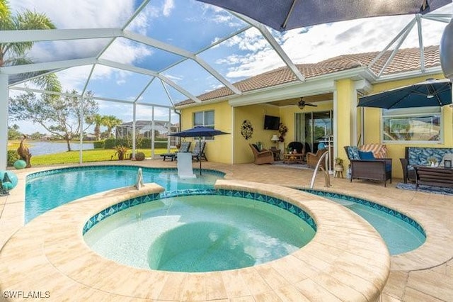 view of pool featuring an in ground hot tub, a lanai, an outdoor living space, and a patio