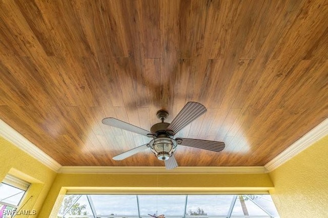 interior details with ceiling fan and ornamental molding