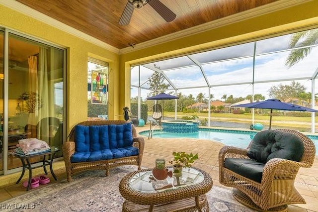 view of swimming pool with glass enclosure, an in ground hot tub, ceiling fan, and a patio