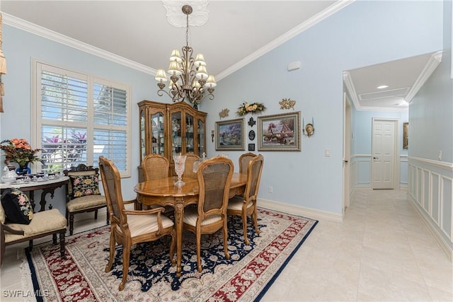 dining room with ornamental molding, light tile patterned floors, and an inviting chandelier