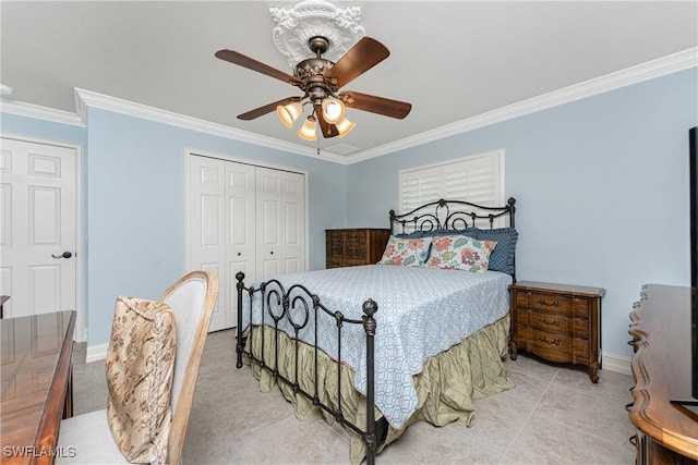 tiled bedroom with a closet, crown molding, and ceiling fan