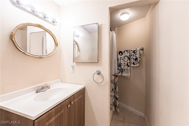 bathroom featuring tile patterned flooring and vanity