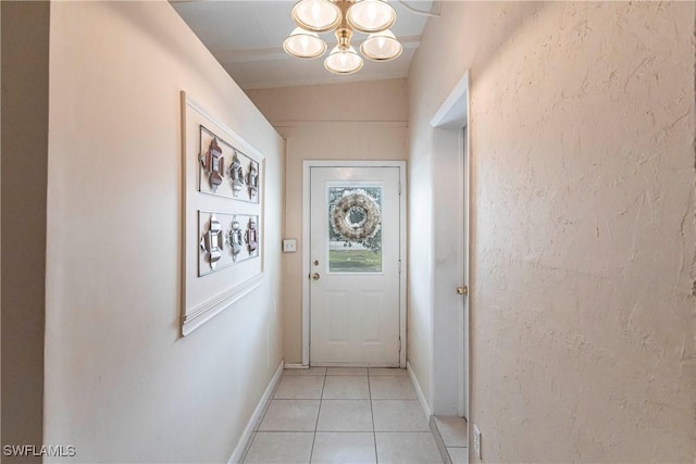 doorway to outside with light tile patterned floors