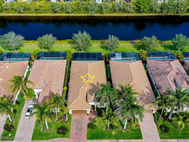 birds eye view of property with a water view