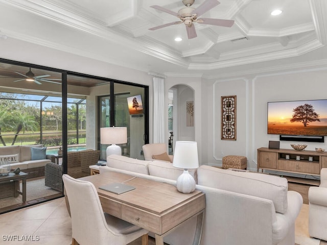 tiled living room with coffered ceiling, beam ceiling, ornamental molding, and ceiling fan